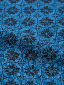 Bluse i merinould med nordisk mønster til baby