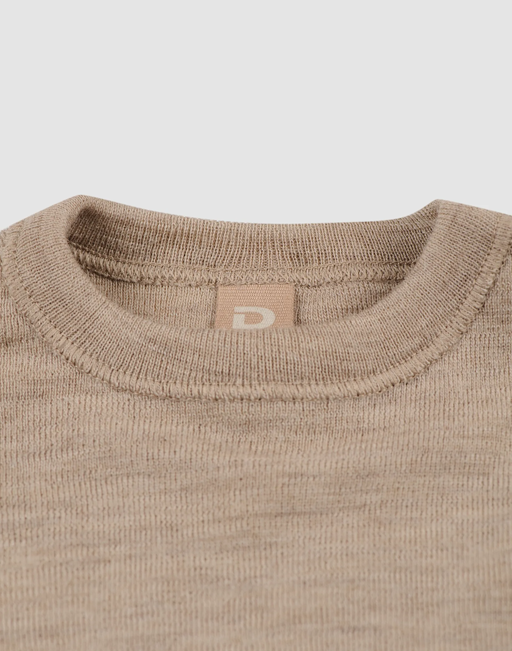 Bluse i merinould til baby