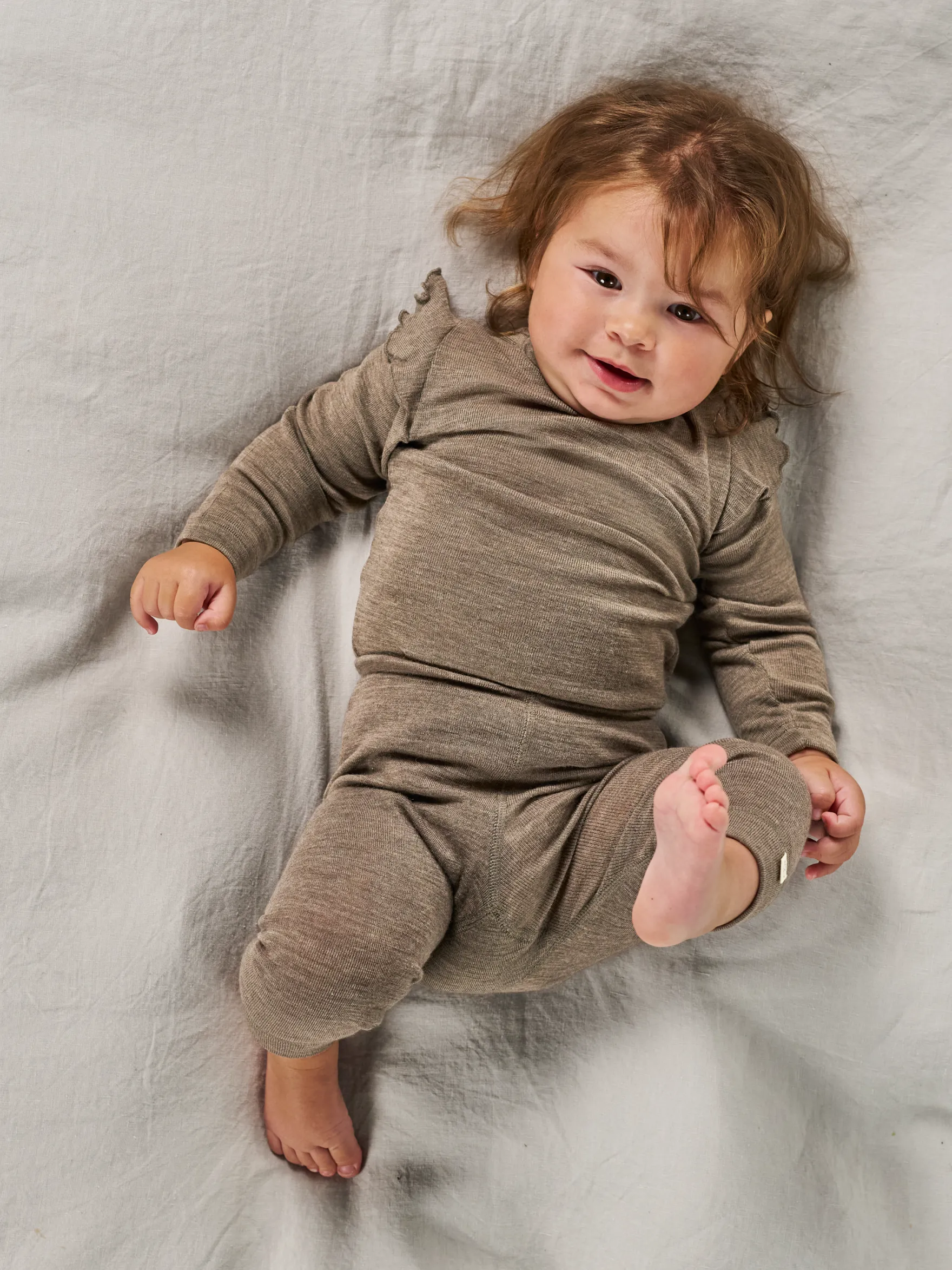 Bluse i merinould til baby