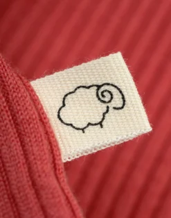 Bluse med flæser i merinould til baby