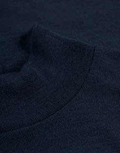 Bluse med høj hals i merinould til kvinder