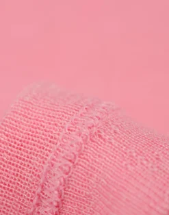 Bluse med hulmønster i merinould/silke til baby