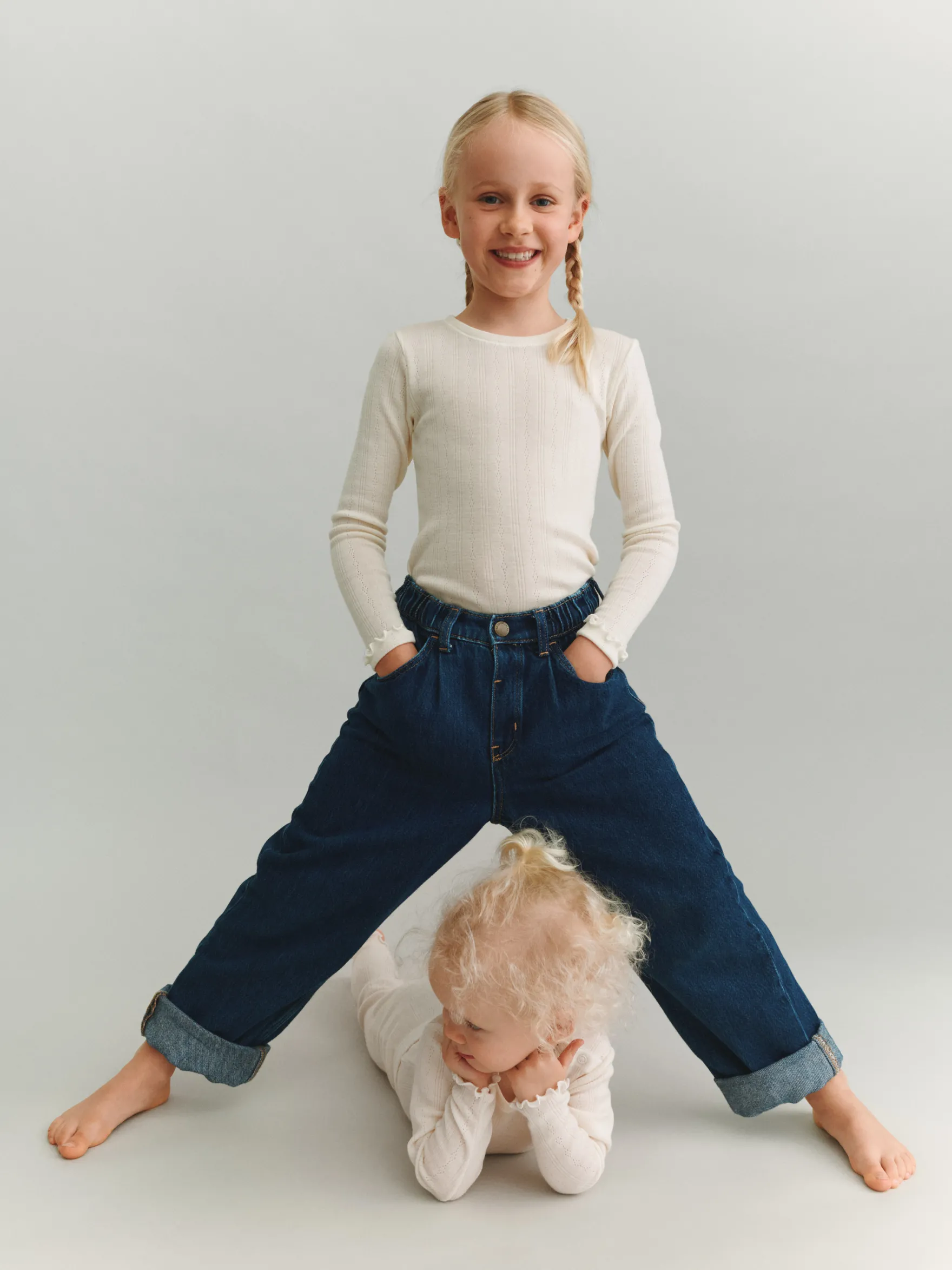 Body i merinould med hulmønster til baby