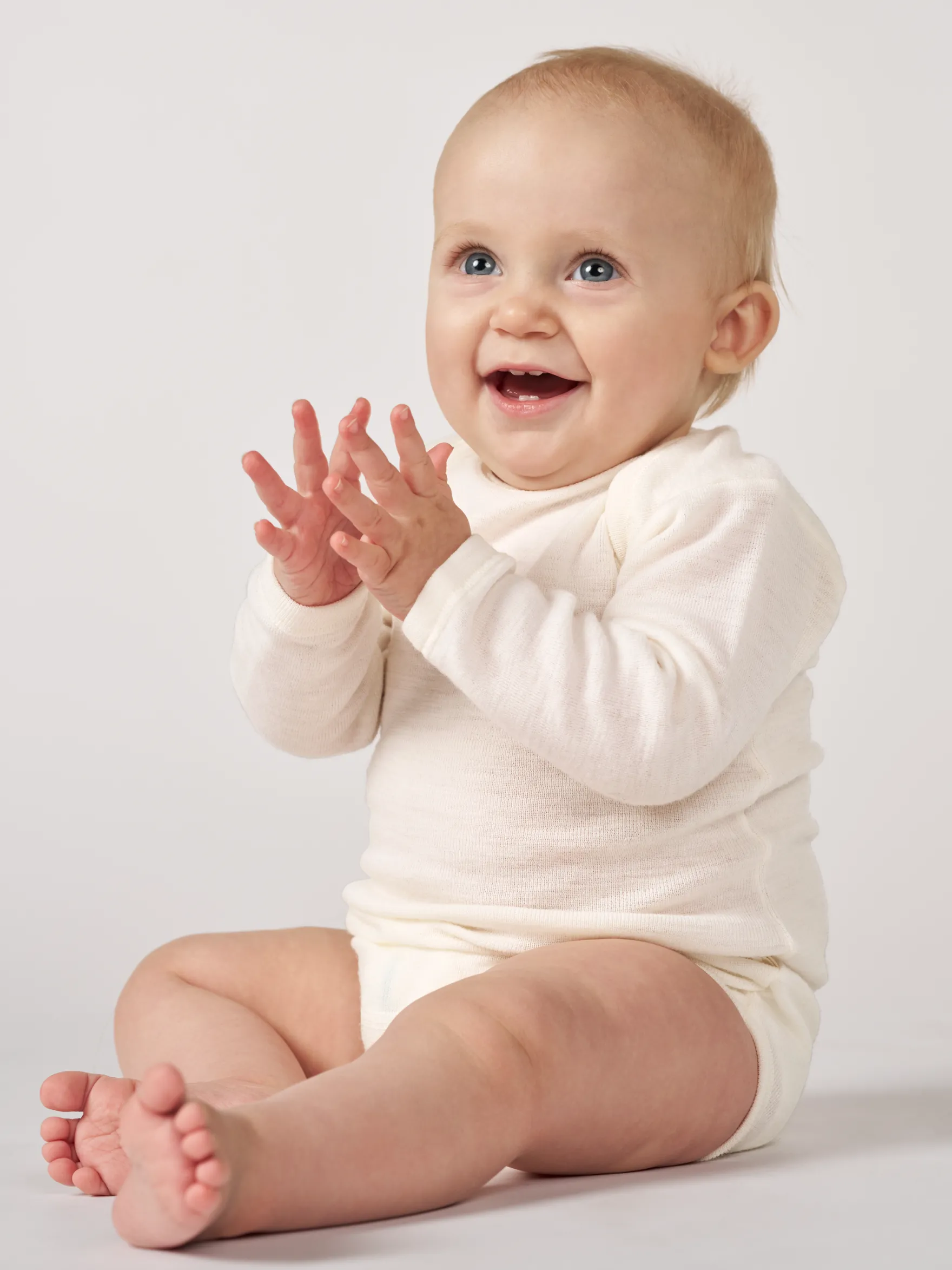 Body med lange ærmer i merinould til baby