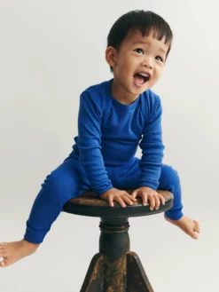 Body med lange ærmer i merinould til baby