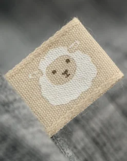 Body med lange ærmer i merinould til baby