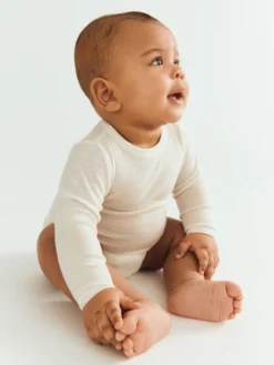 Body med lange ærmer i merinould/silke til baby