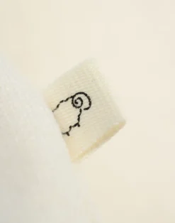 Body uden ærmer i merinould til baby