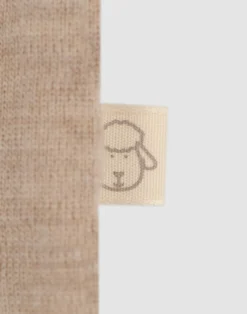 Kjole med flæser i merinould til baby