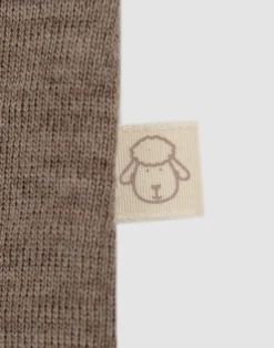 Kjole med flæser i merinould til baby