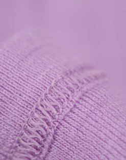 Kjole med flæser i merinould til baby