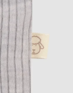 Kjole med flæser i merinould til baby
