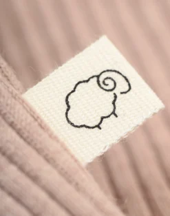 Kjole med flæser i merinould til baby