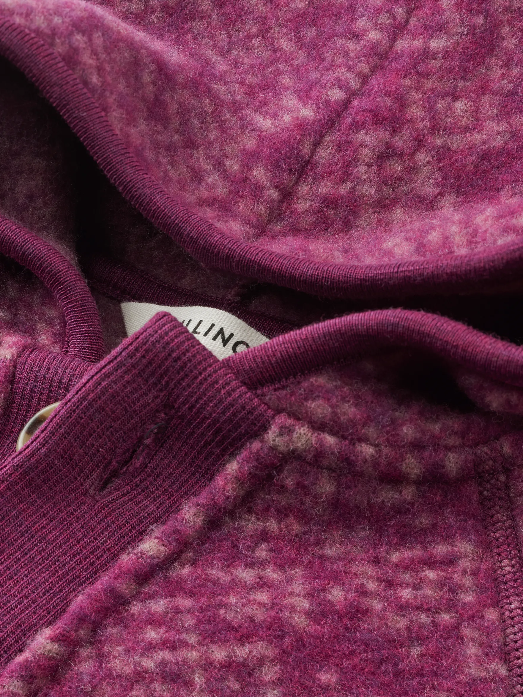Køredragt med hætte i merinouldfleece til baby