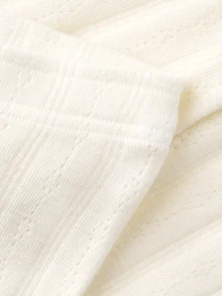 Leggings i merinould med hulmønster til baby