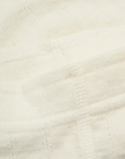 Leggings med hulmønster i merinould/silke til baby