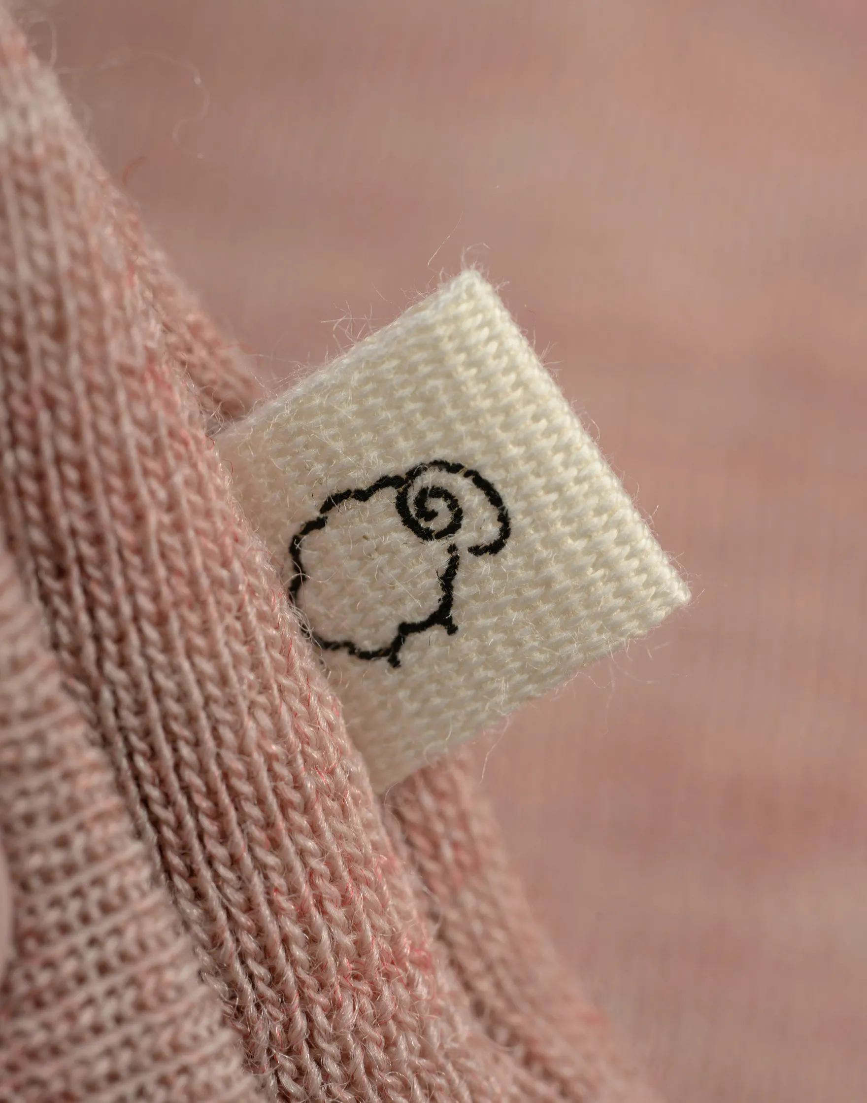 Slå-om-bluse i merinould til baby