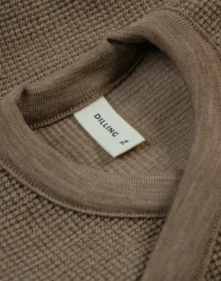 Vaffelstrikket slå-om-bluse i merinould til baby