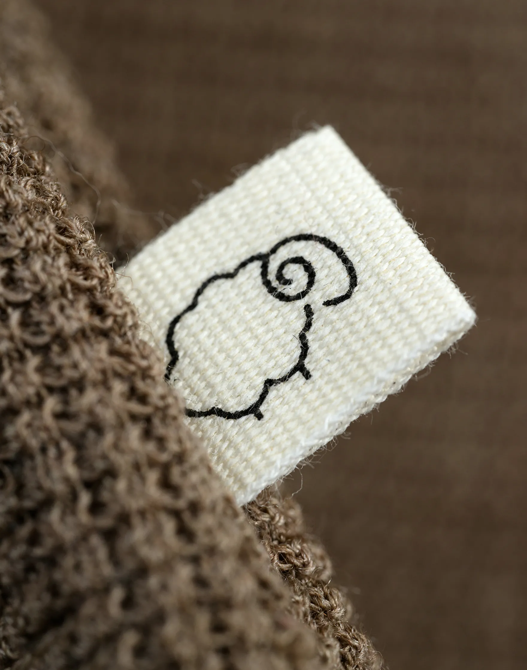 Vaffelstrikket slå-om-bluse i merinould til baby